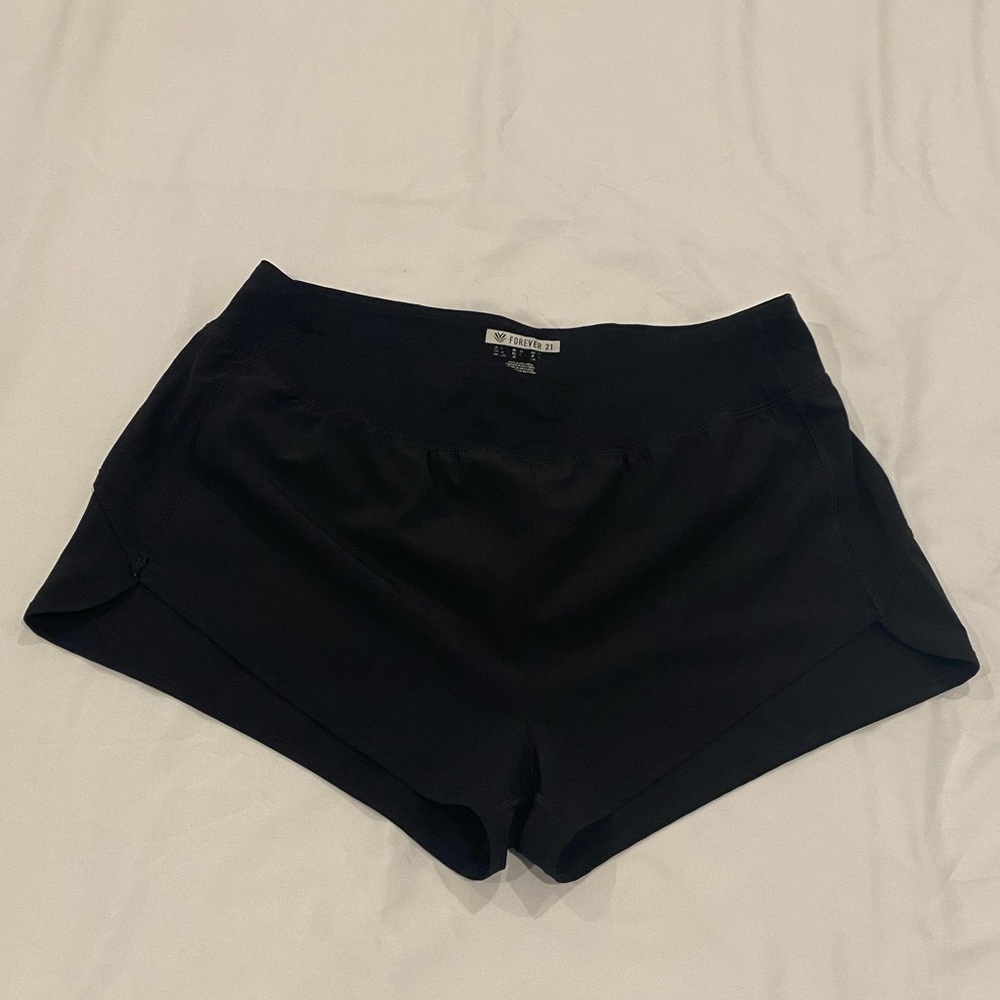 FOREVER 21 black dolphin hem workout shorts